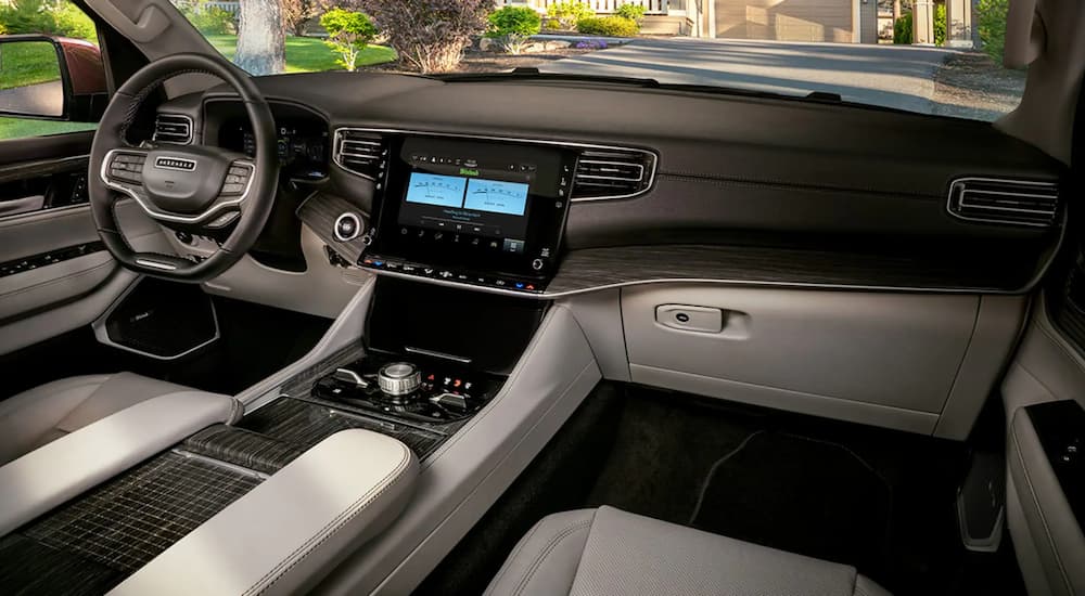 The black and grey interior of a 2022 Wagoneer, seen from the passenger's seat.