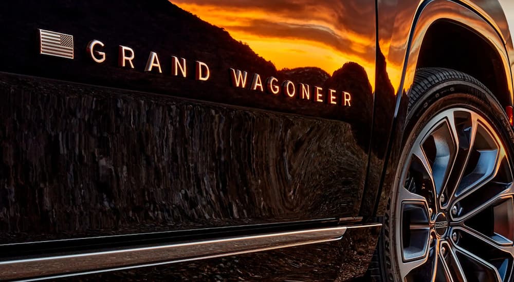 Close-up of the door badge on a 2022 Grand Wagoneer at sunset.