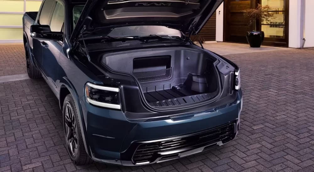 The frunk of a 2024 Ram 1500 REV is shown after leaving a dealer that has a Ram 1500 for sale