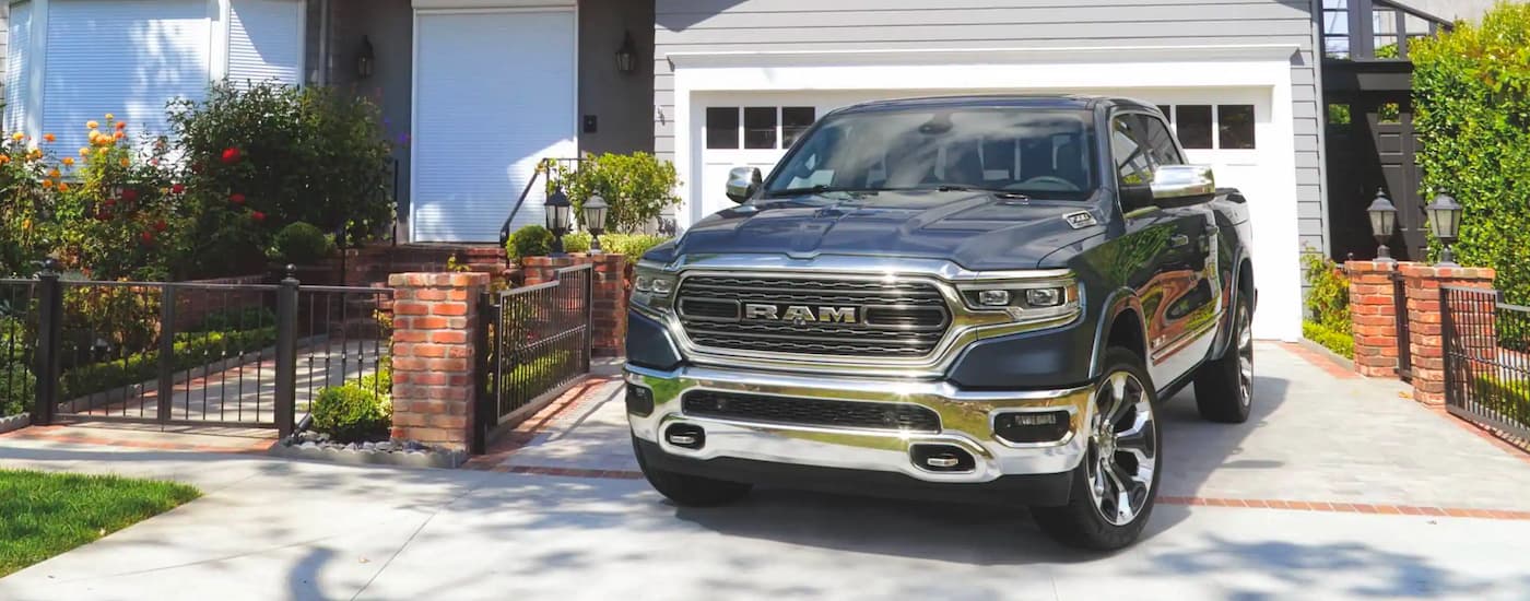 A grey 2022 Ram 1500 is shown parked in a driveway after leaving a New Jersey Ram 1500 dealership.