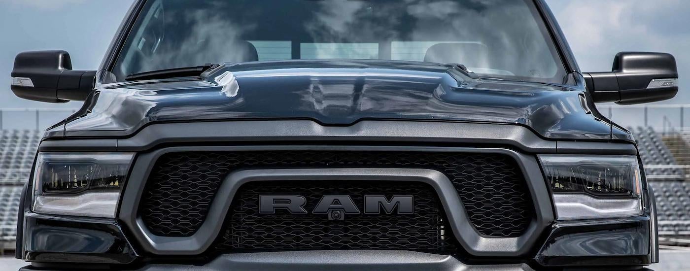 A close up of the grille on a black 2023 Ram 1500 Rebel is shown from the front at a Ram dealer near you.
