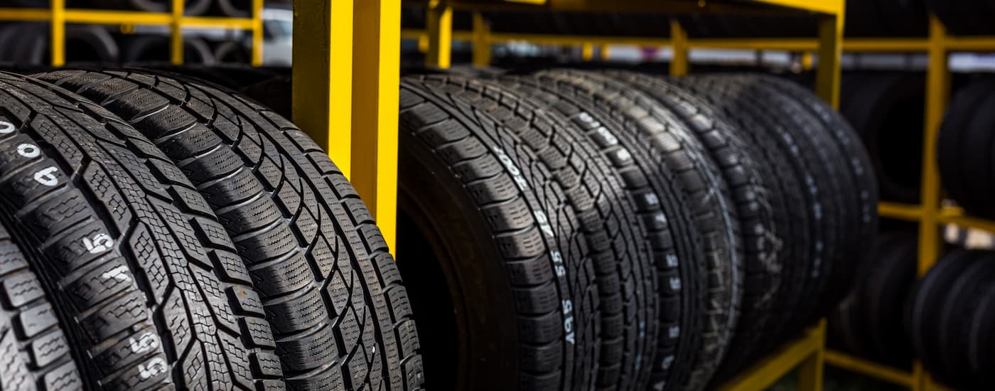 A rack of tires are shown at a tire rotation service center.