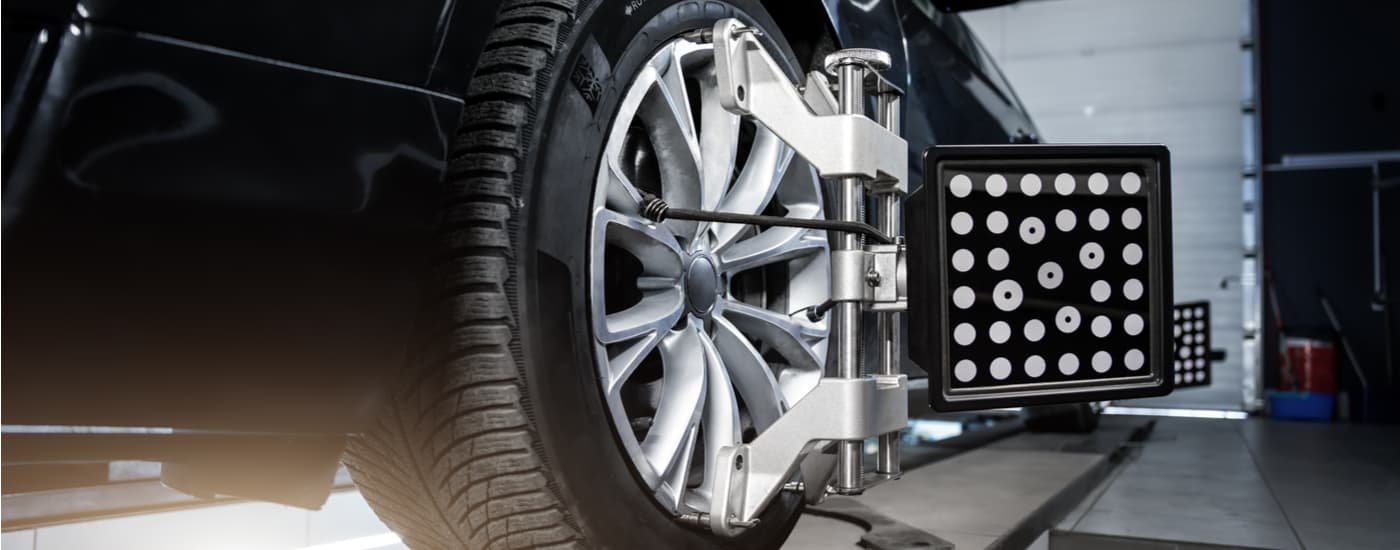 A car is shown getting a wheel alignment near you.