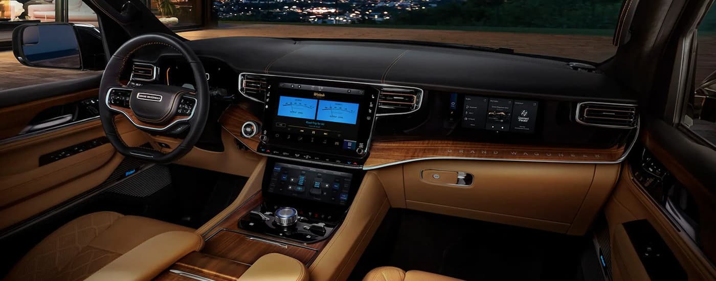 The black and tan interior of a 2022 Grand Wagoneer is shown at a NJ Grand Wagoneer dealer.